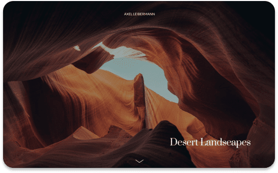 Desert canyon interior: red rock walls curve upward toward a small patch of blue sky. Desert Landscapes text is visible